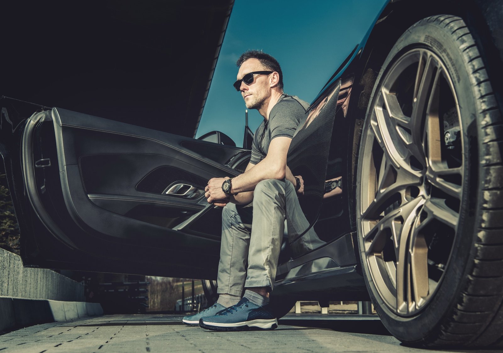 Caucasian Driver Seating Inside His Modern Exotic Sporty Car
